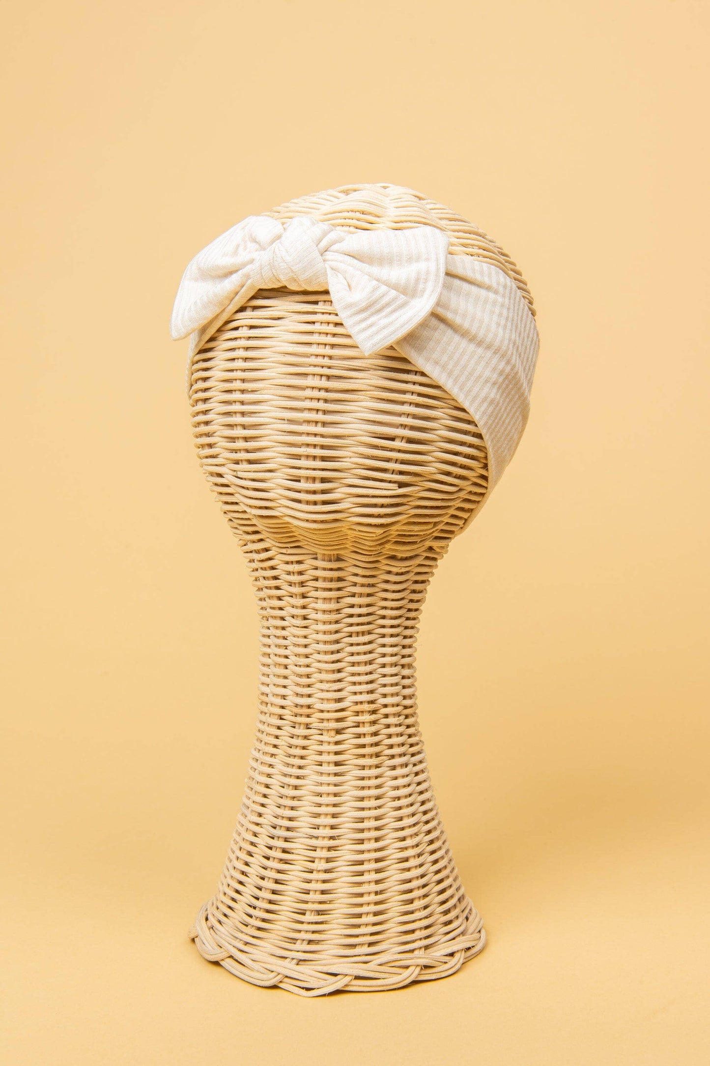Made from the most luxuriously soft bamboo fabric, in a trendy ribbed texture. The fabric is incredibly soft, and super stretchy. With a removable bow, this also doubles as a plain headband. Perfect for newborns, infants & toddlers.