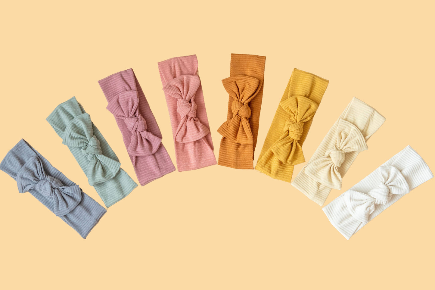 Made from the most luxuriously soft bamboo fabric, in a trendy ribbed texture. The fabric is incredibly soft, and super stretchy. With a removable bow, this also doubles as a plain headband. Perfect for newborns, infants & toddlers.