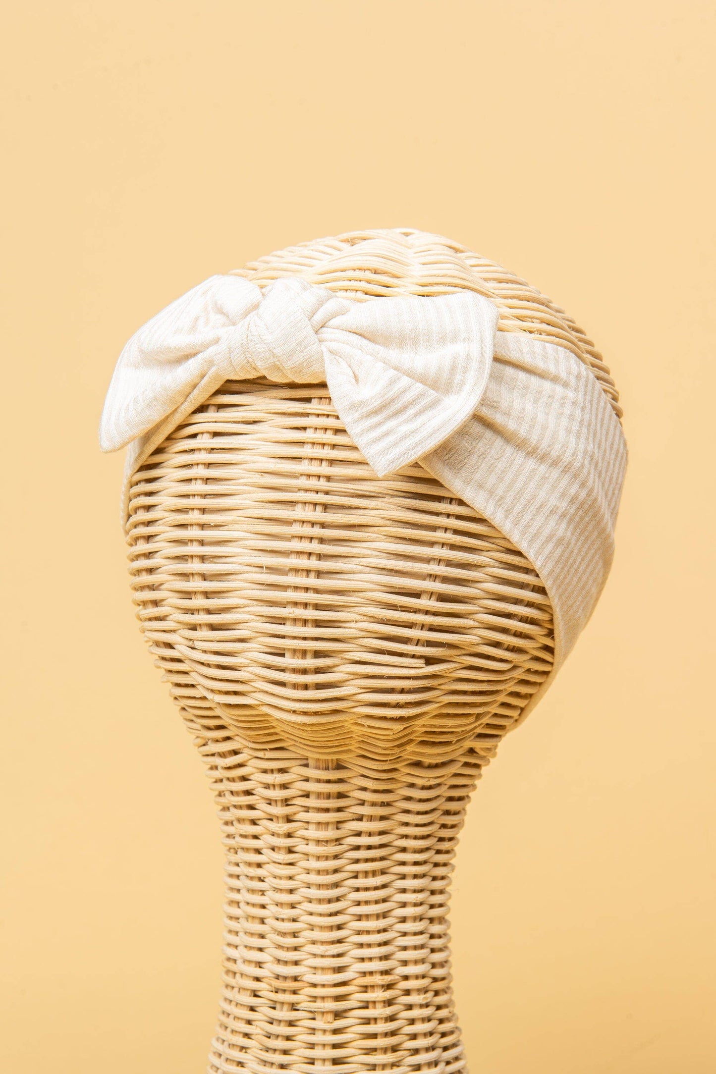 Made from the most luxuriously soft bamboo fabric, in a trendy ribbed texture. The fabric is incredibly soft, and super stretchy. With a removable bow, this also doubles as a plain headband. Perfect for newborns, infants & toddlers.