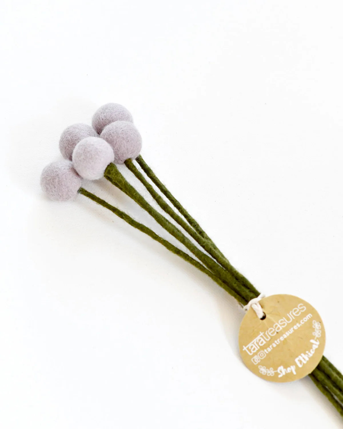 Light Purple Hand-felted with attention to detail, this set of 5 Felt Billy Bottoms feature a calming pastel hue. Made entirely from NZ wool felt and natural dye colours, you will never have to replace these flowers. There is a wire in the stem of each billy button so that you can add these to a floral arrangement.