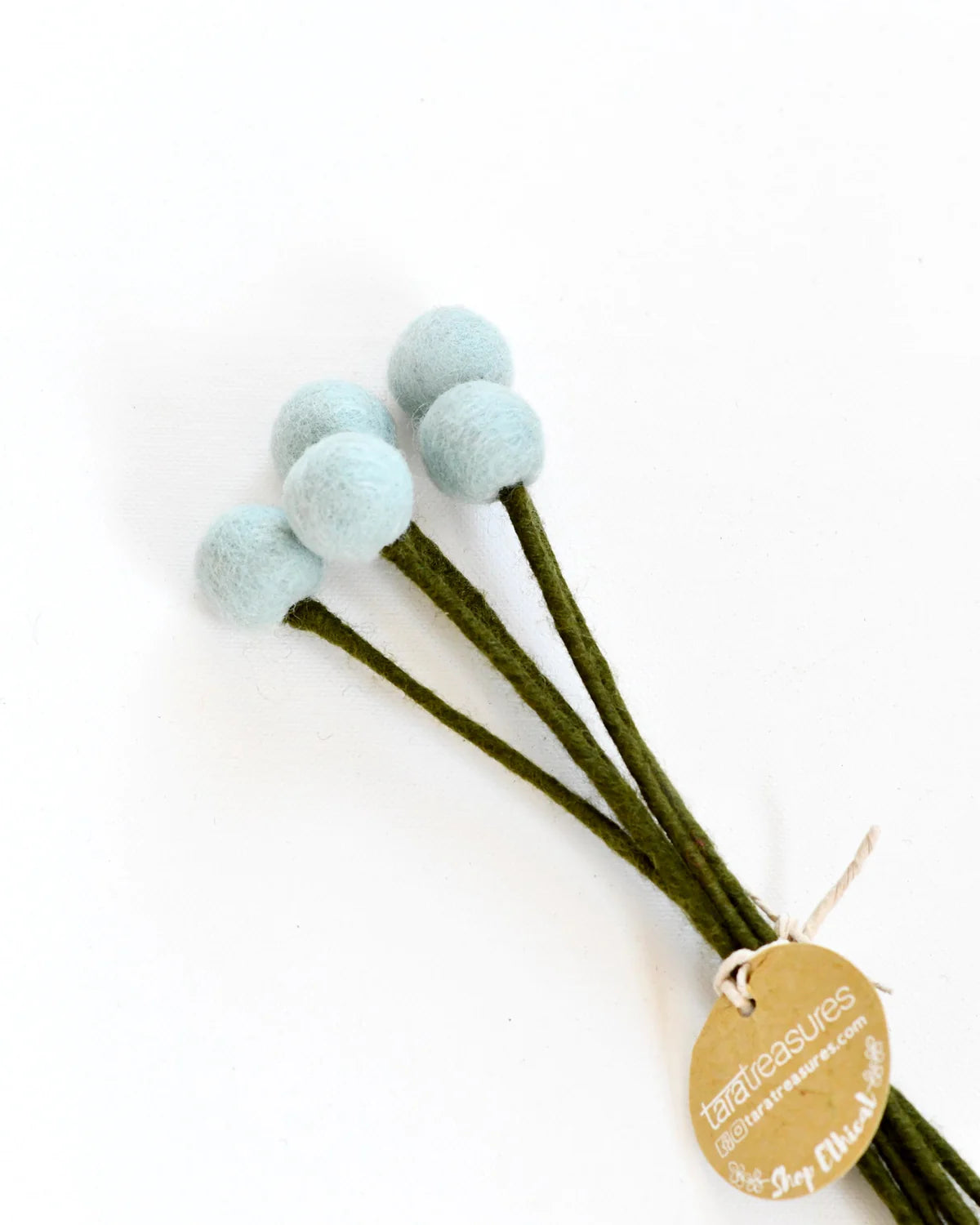 Light Blue Hand-felted with attention to detail, this set of 5 Felt Billy Bottoms feature a calming pastel hue. Made entirely from NZ wool felt and natural dye colours, you will never have to replace these flowers. There is a wire in the stem of each billy button so that you can add these to a floral arrangement.