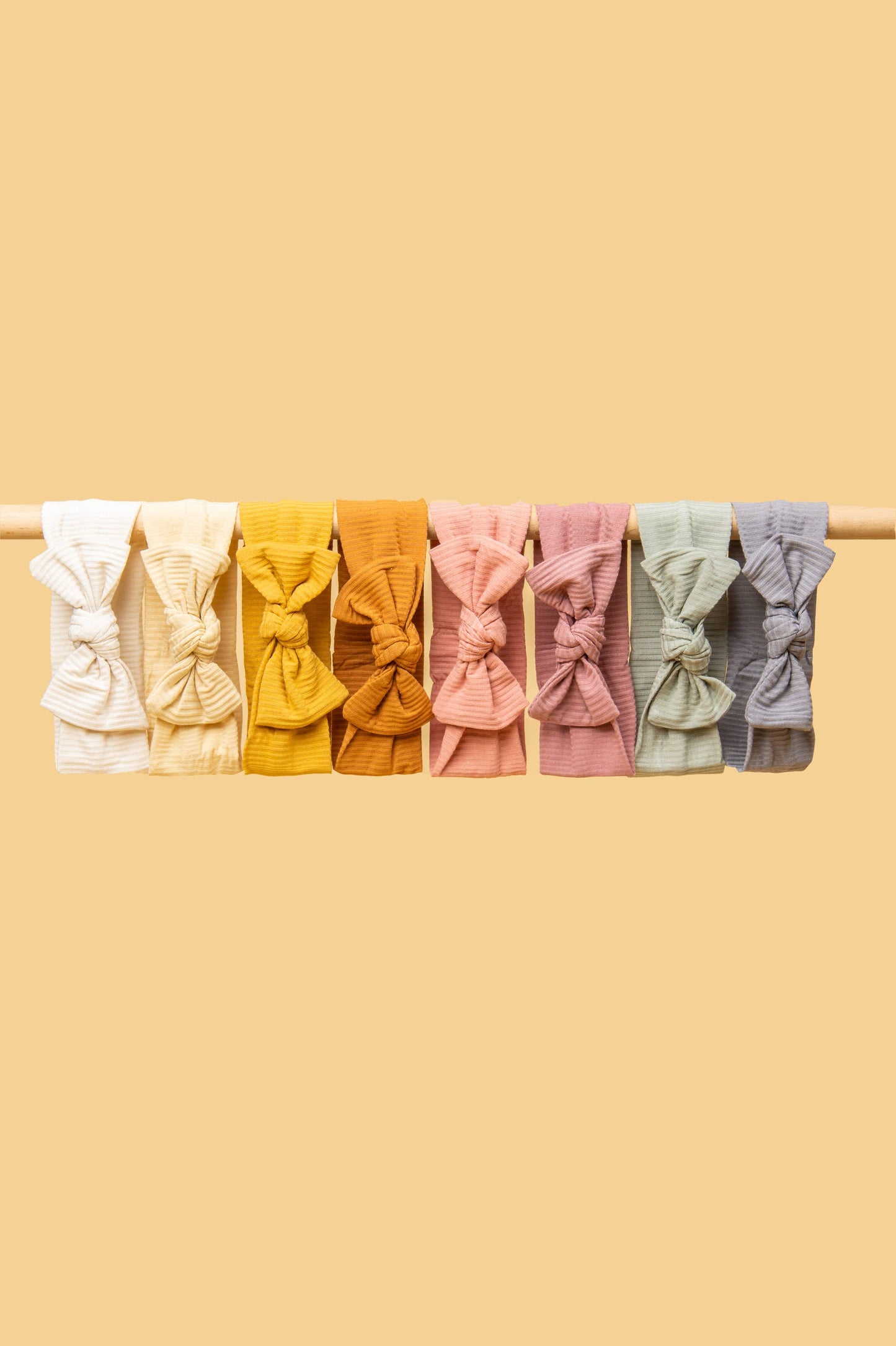 Made from the most luxuriously soft bamboo fabric, in a trendy ribbed texture. The fabric is incredibly soft, and super stretchy. With a removable bow, this also doubles as a plain headband. Perfect for newborns, infants & toddlers.