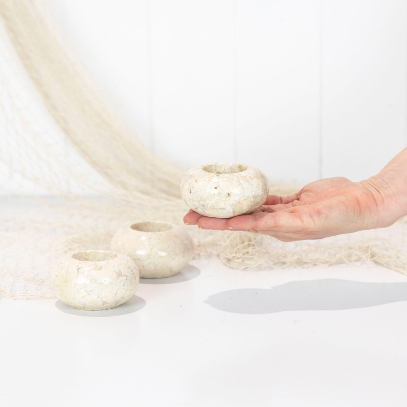 These tea light candle holders has been made out of a creamy coloured stone!
A lovely addition to a sideboard or coffee table
As these are made from natural stone the colour, size and detail can vary a little. We will select for you from stock on hand at the time of purchase.
Measures approx: 7cm diameter x 4cm