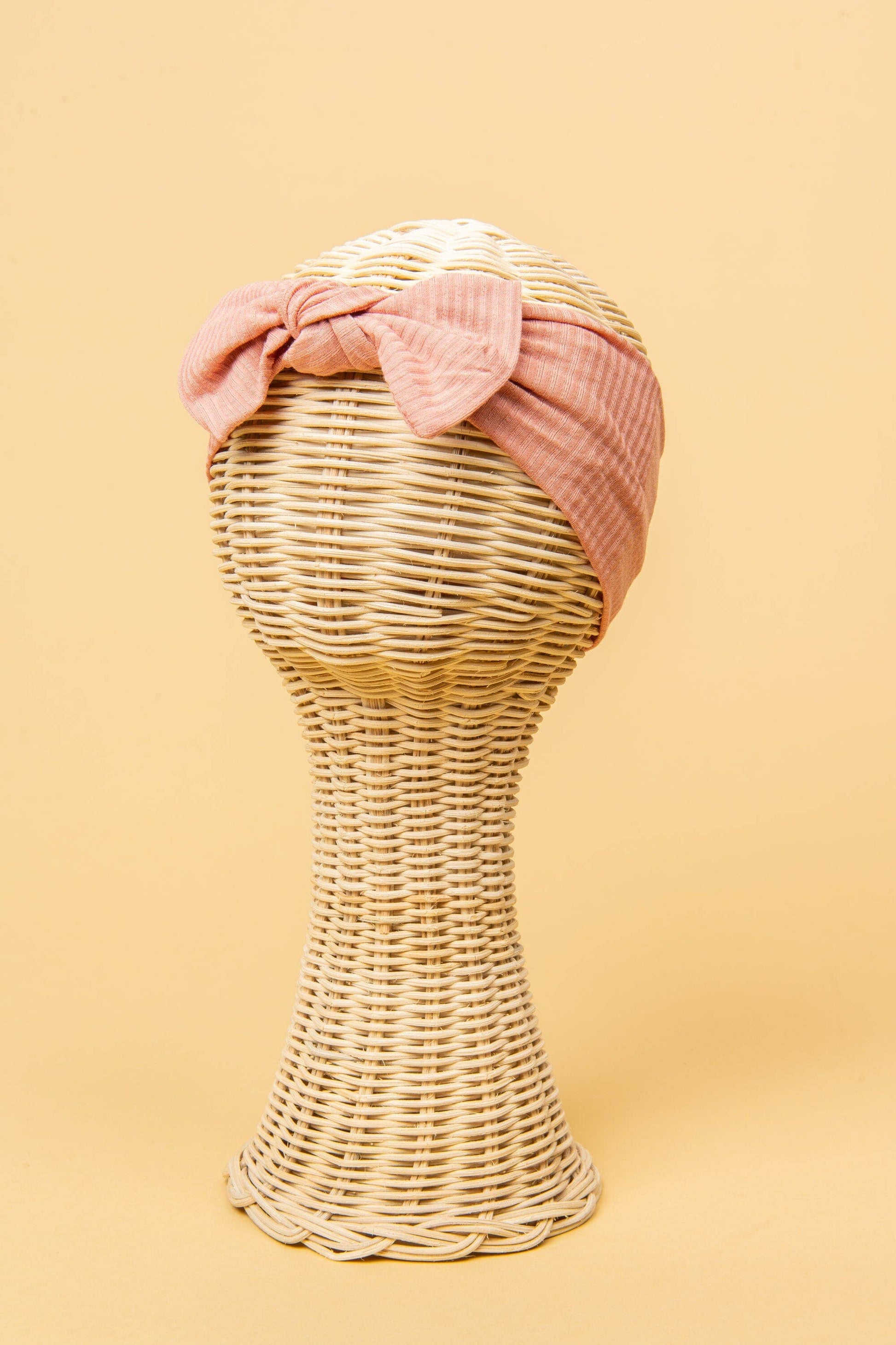 Made from the most luxuriously soft bamboo fabric, in a trendy ribbed texture. The fabric is incredibly soft, and super stretchy. With a removable bow, this also doubles as a plain headband. Perfect for newborns, infants & toddlers.