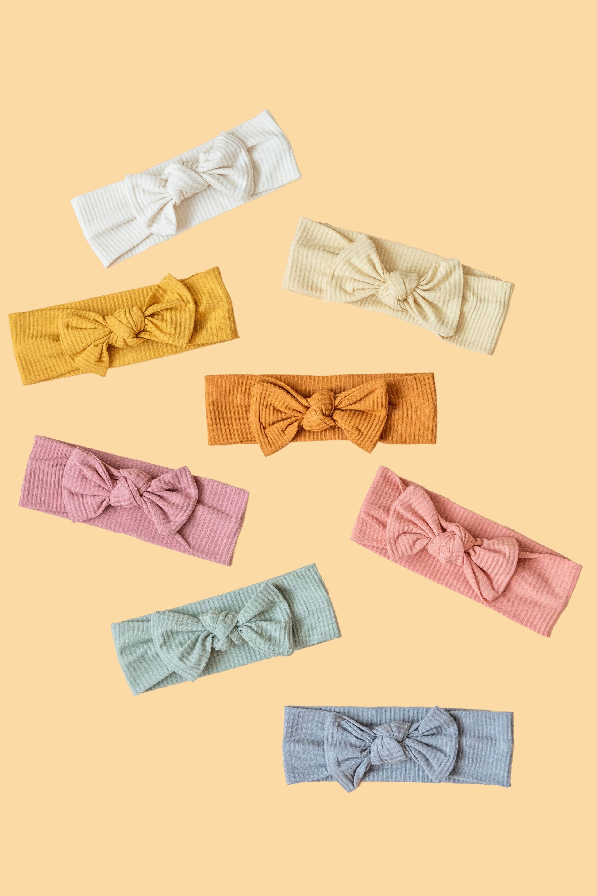 Made from the most luxuriously soft bamboo fabric, in a trendy ribbed texture. The fabric is incredibly soft, and super stretchy. With a removable bow, this also doubles as a plain headband. Perfect for newborns, infants & toddlers.