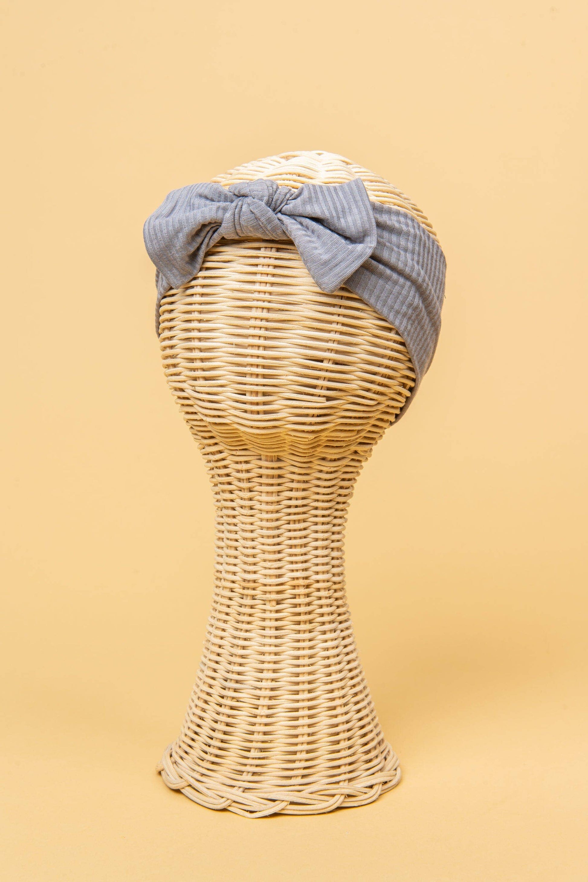 Made from the most luxuriously soft bamboo fabric, in a trendy ribbed texture. The fabric is incredibly soft, and super stretchy. With a removable bow, this also doubles as a plain headband. Perfect for newborns, infants & toddlers.