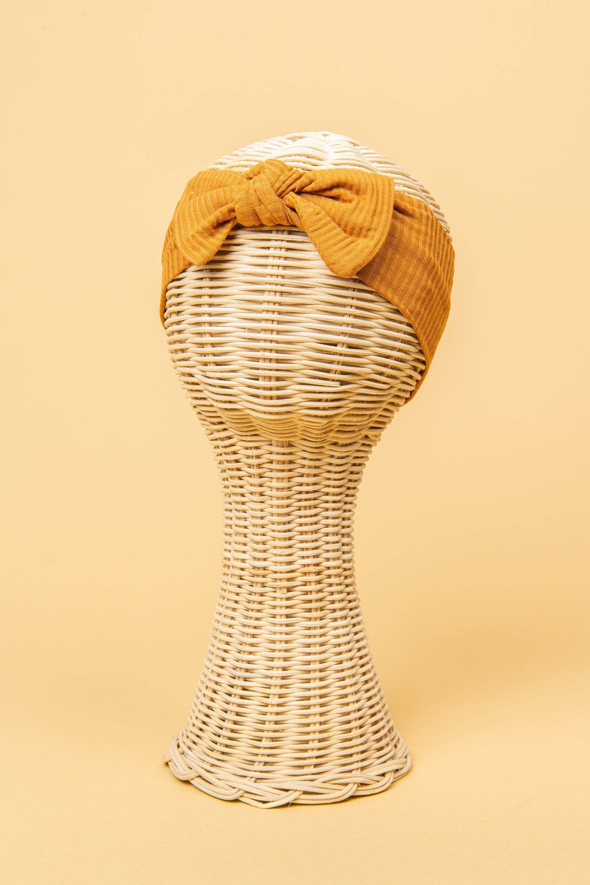 Made from the most luxuriously soft bamboo fabric, in a trendy ribbed texture. The fabric is incredibly soft, and super stretchy. With a removable bow, this also doubles as a plain headband. Perfect for newborns, infants & toddlers.