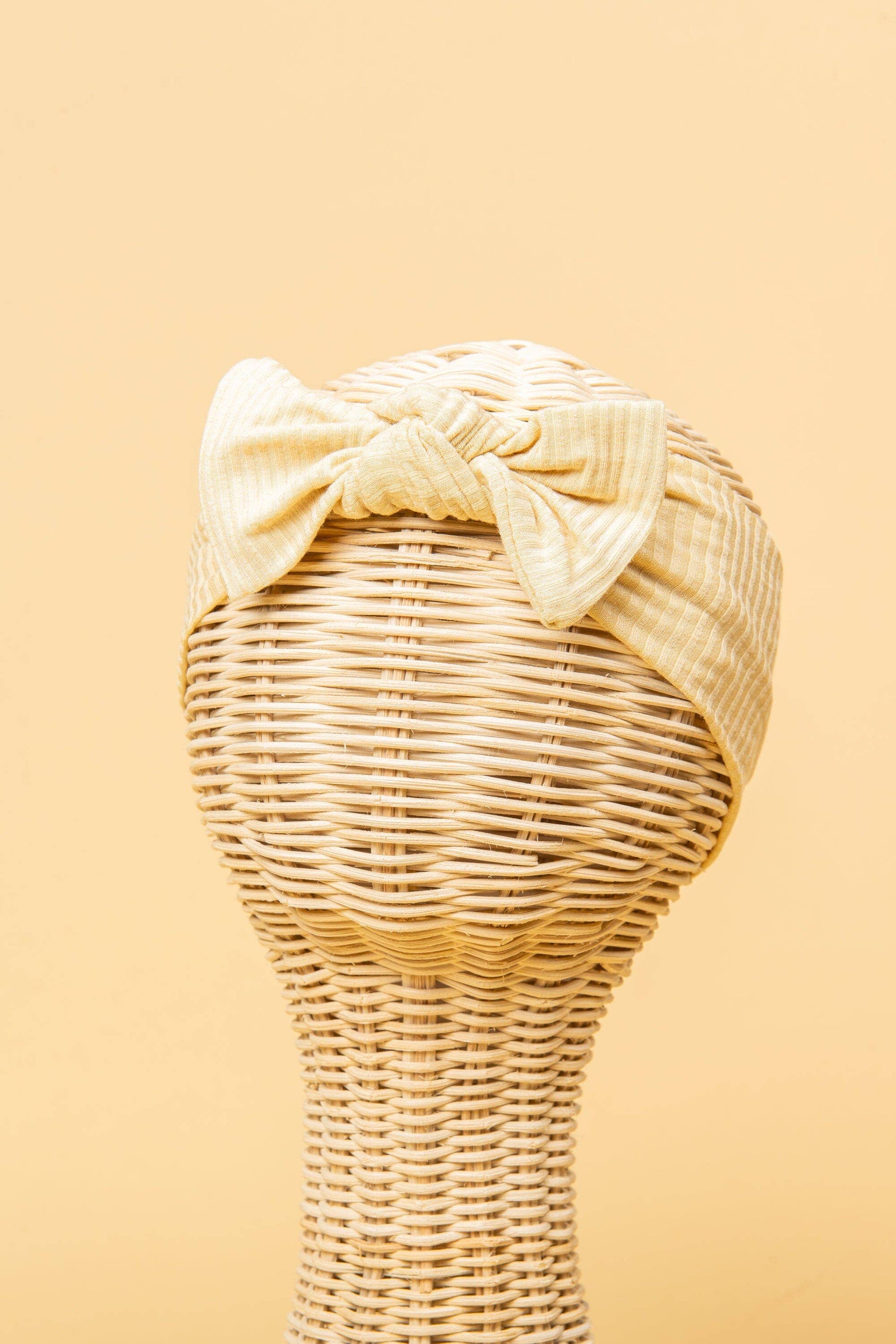 Made from the most luxuriously soft bamboo fabric, in a trendy ribbed texture. The fabric is incredibly soft, and super stretchy. With a removable bow, this also doubles as a plain headband. Perfect for newborns, infants & toddlers.