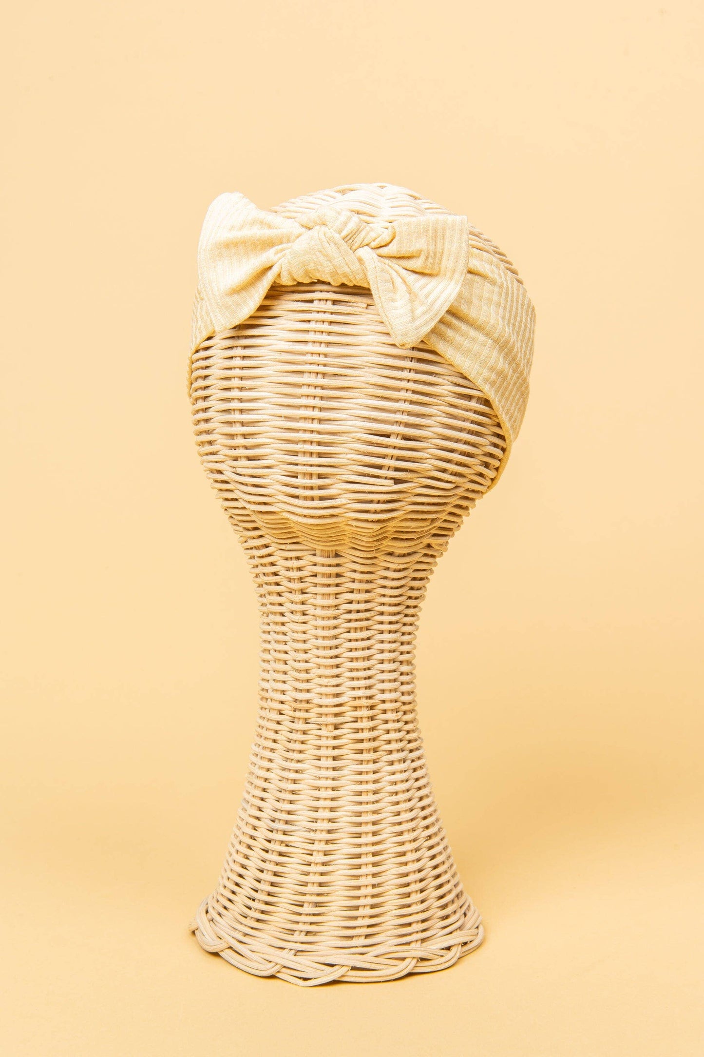 Made from the most luxuriously soft bamboo fabric, in a trendy ribbed texture. The fabric is incredibly soft, and super stretchy. With a removable bow, this also doubles as a plain headband. Perfect for newborns, infants & toddlers.