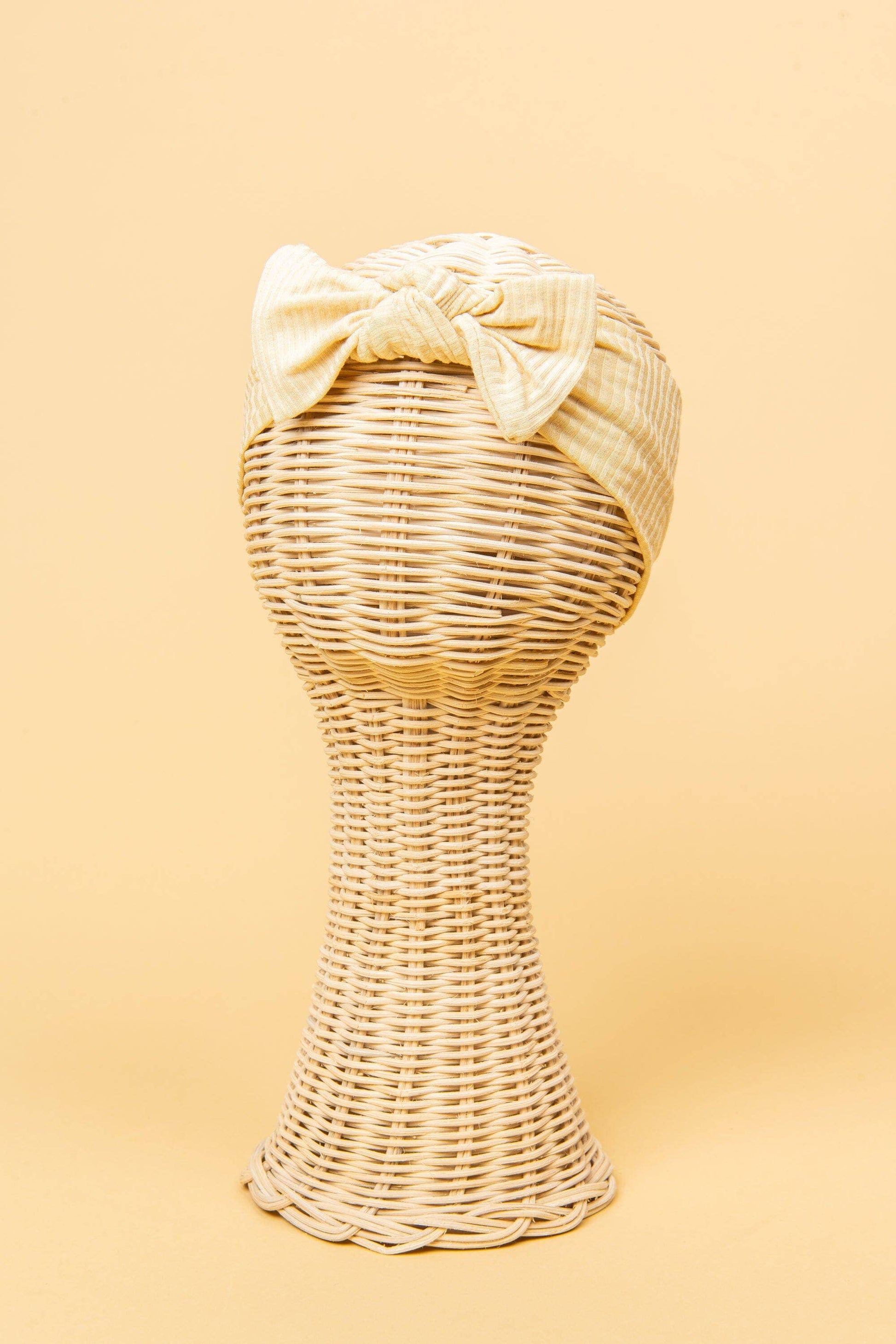 Made from the most luxuriously soft bamboo fabric, in a trendy ribbed texture. The fabric is incredibly soft, and super stretchy. With a removable bow, this also doubles as a plain headband. Perfect for newborns, infants & toddlers.