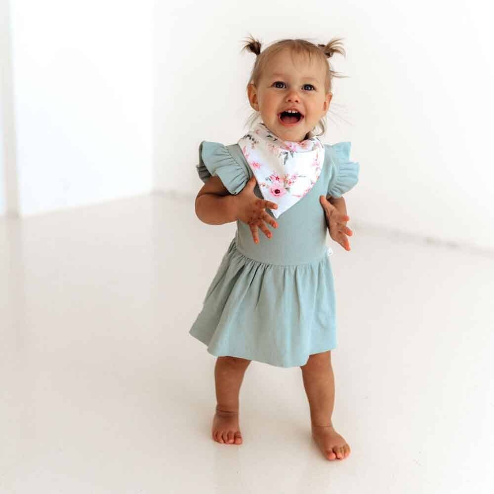  This short-sleeve dress comes in our beautiful sage ribbed organic cotton, perfect for summer.  Soft and stretchy, they are easy-care and very comfy for bub.  The sizes up to and including size 1 come with a snap underbody to go over a nappy.  Short enough so that a baby can crawl and not trip over the skirt. 