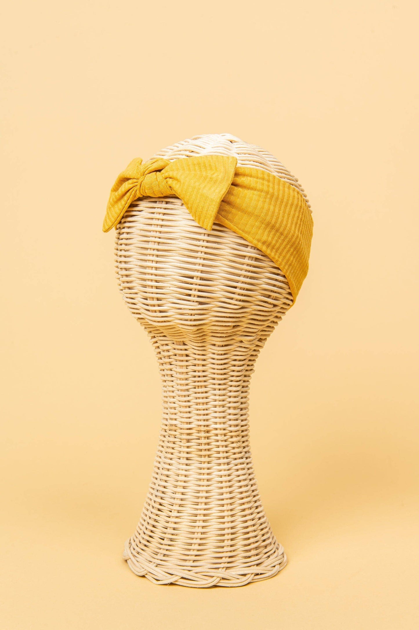 Made from the most luxuriously soft bamboo fabric, in a trendy ribbed texture. The fabric is incredibly soft, and super stretchy. With a removable bow, this also doubles as a plain headband. Perfect for newborns, infants & toddlers.