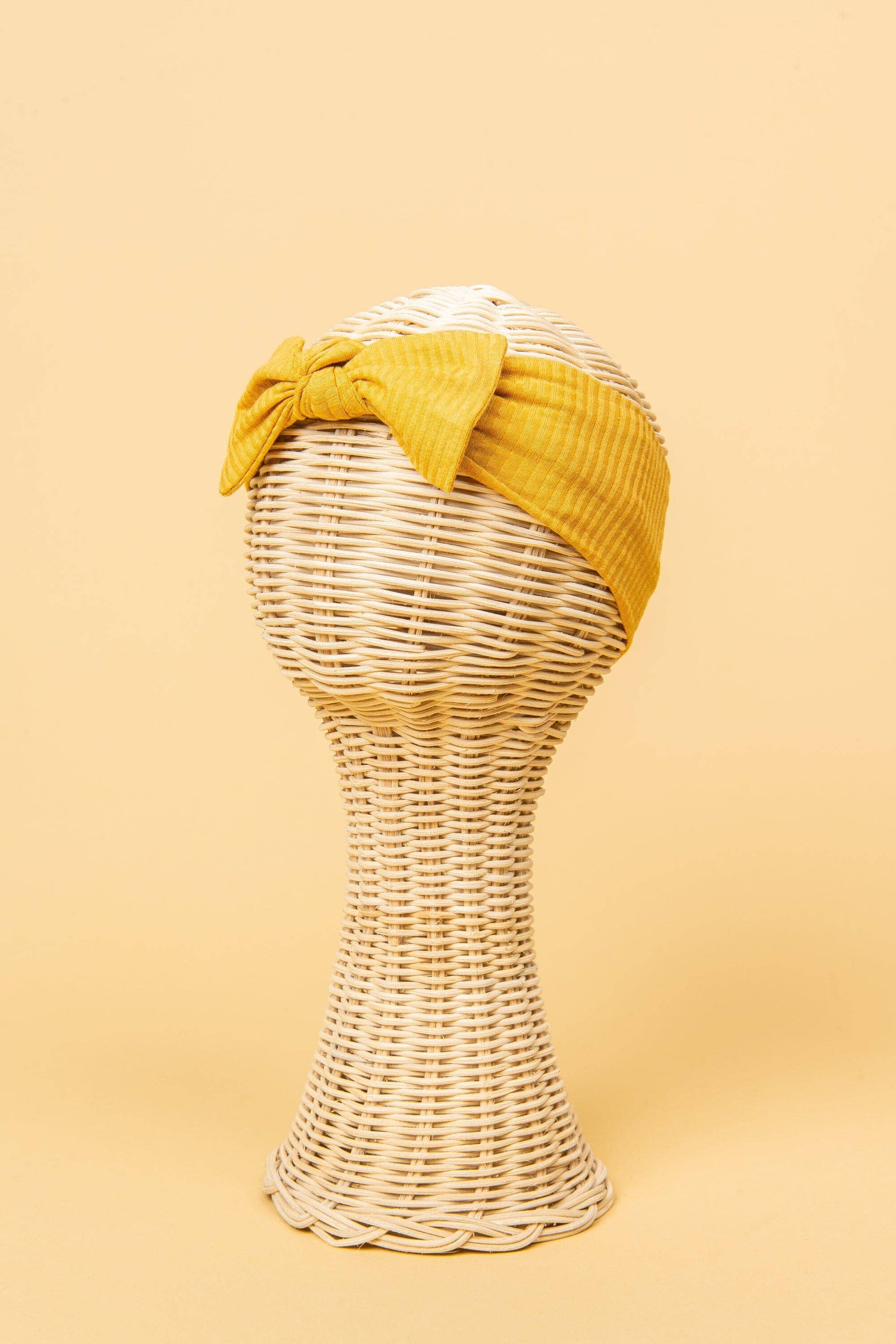 Made from the most luxuriously soft bamboo fabric, in a trendy ribbed texture. The fabric is incredibly soft, and super stretchy. With a removable bow, this also doubles as a plain headband. Perfect for newborns, infants & toddlers.