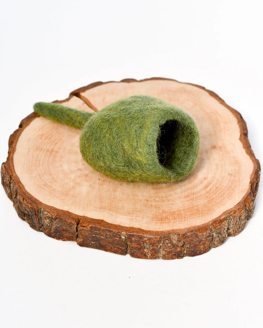 Inspired by the iconic Gumnut Pod found in the Australian landscape, our felt rendition captures the essence of these natural wonders. Each Gumnut Pod is handcrafted by skilled artisans. It can be used to contain small items for small world play.