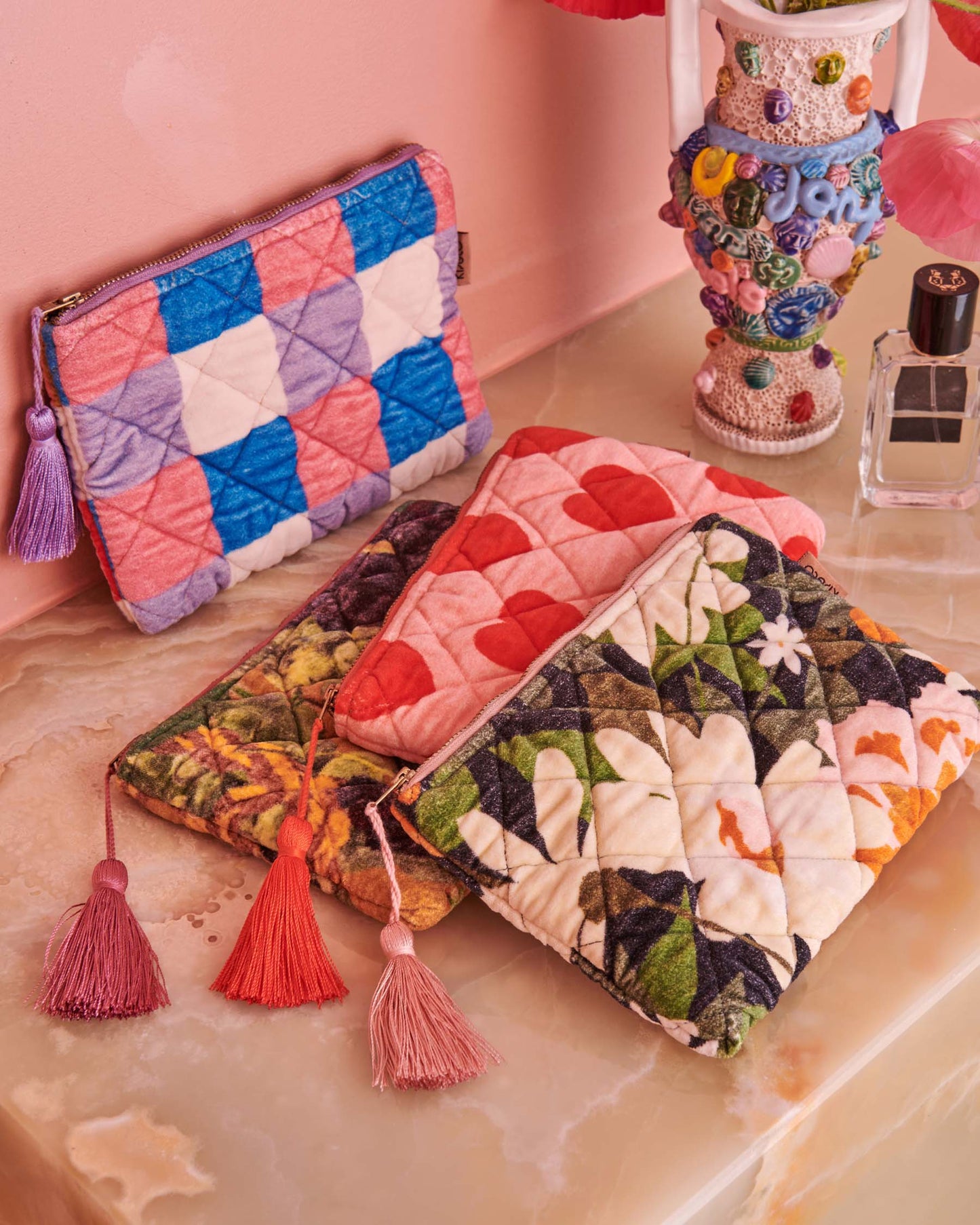  Kip&Co is your destination for toiletry essentials! Our cosmetic and toiletry bags are tried and tested travel favourites, perfectly sized for your favourite skincare and cosmetic must-haves. The Summer Check Velvet Cosmetics Purse features printed quilted velvet with a check pattern of pink, purple, blue, red, mustard brown and white with feature purple zip tassel.