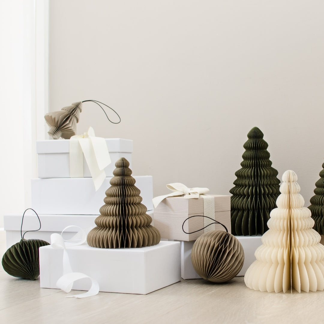 Handcrafted paper Classic Standing Trees are the perfect Christmas Statement. Designed to create a magical feeling in your home by themselves, or with multiple trees together! Mix and match the three sizes and colour tones to reflect your personal aesthetic. The Tree's all fold away with a magnetic close for easy storage after the festive season.