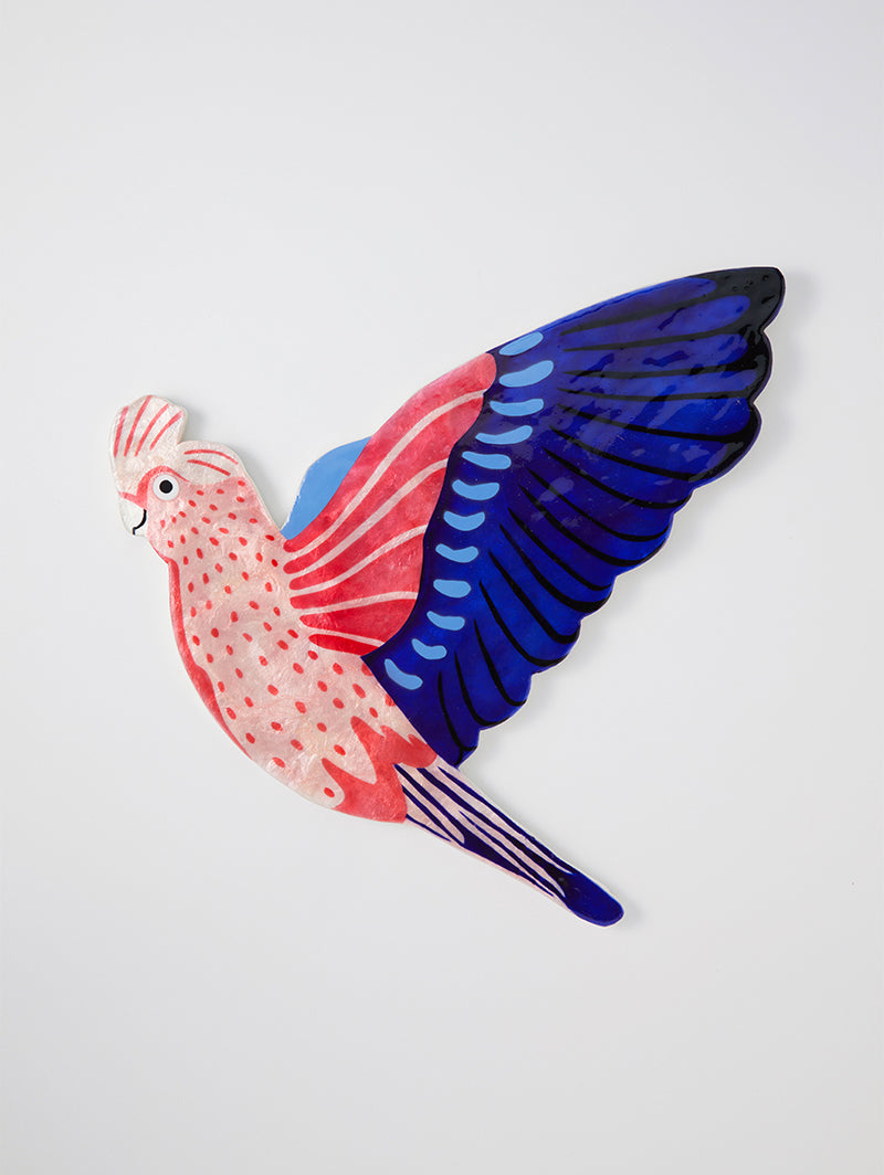 Elevate your walls with the Aerial Galah Wall Art, a striking representation of Australia's iconic Galah.

Crafted from wood and capiz shell, this wall tile showcases the Galah's distinctive pink plumage in exquisite detail. Hang it as a standalone piece or combine it with other tiles from our Aerial Collection to create a fun avian tableau that celebrates the beauty of Australian birds.