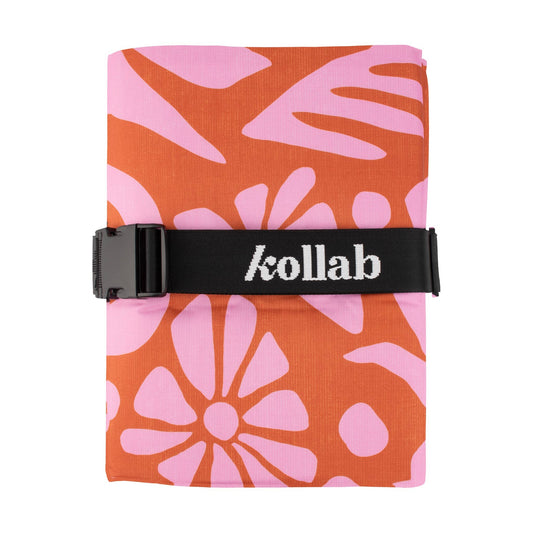 The bestselling Kollab Picnic Mat to share with your family and friends, now made from recycled plastic bottles as part of our Holiday Collection.  
  
Finally, a mat that really is big, water resistant and easy to fold! Having been frustrated with most large picnic mats out there that need to be folded up in the exact same way, we designed our picnic mats with an adjustable strap so that they don’t need to be folded in any specific way. Just fold or roll it up however you please and adjust the strap to sui