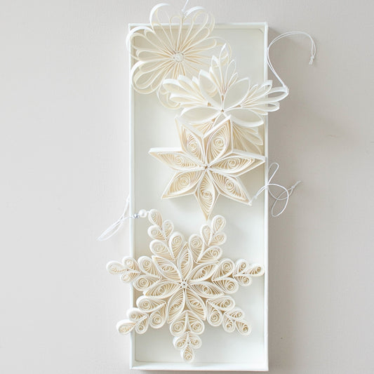 Delicate, intricate and an artisan peice for your Christmas decor collection. This 3 piece set includes 3 paper quilling stars in different designs and comes in a gorgeous white gift box.