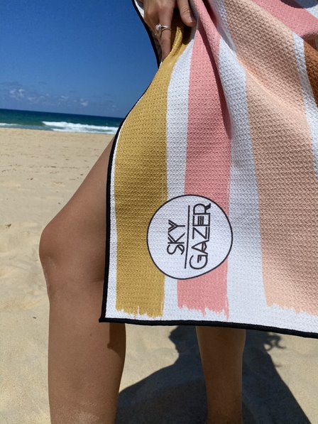 Say G'Day to Sky Gazer's vibrant range of luxury beach towels. Soft, sand free, odourless, ultra-absorbent, quick dry and durable! What's there not to love?  Sky Gazer towels are the ultimate, on-trend and standout accessory whether it be for travel, gym, beach or pool. Exquisitely engineered using our innovative SandResist™ fabric. So, whether you're buying for yourself or as a perfect birthday gift for a friend you won't be disappointed. 