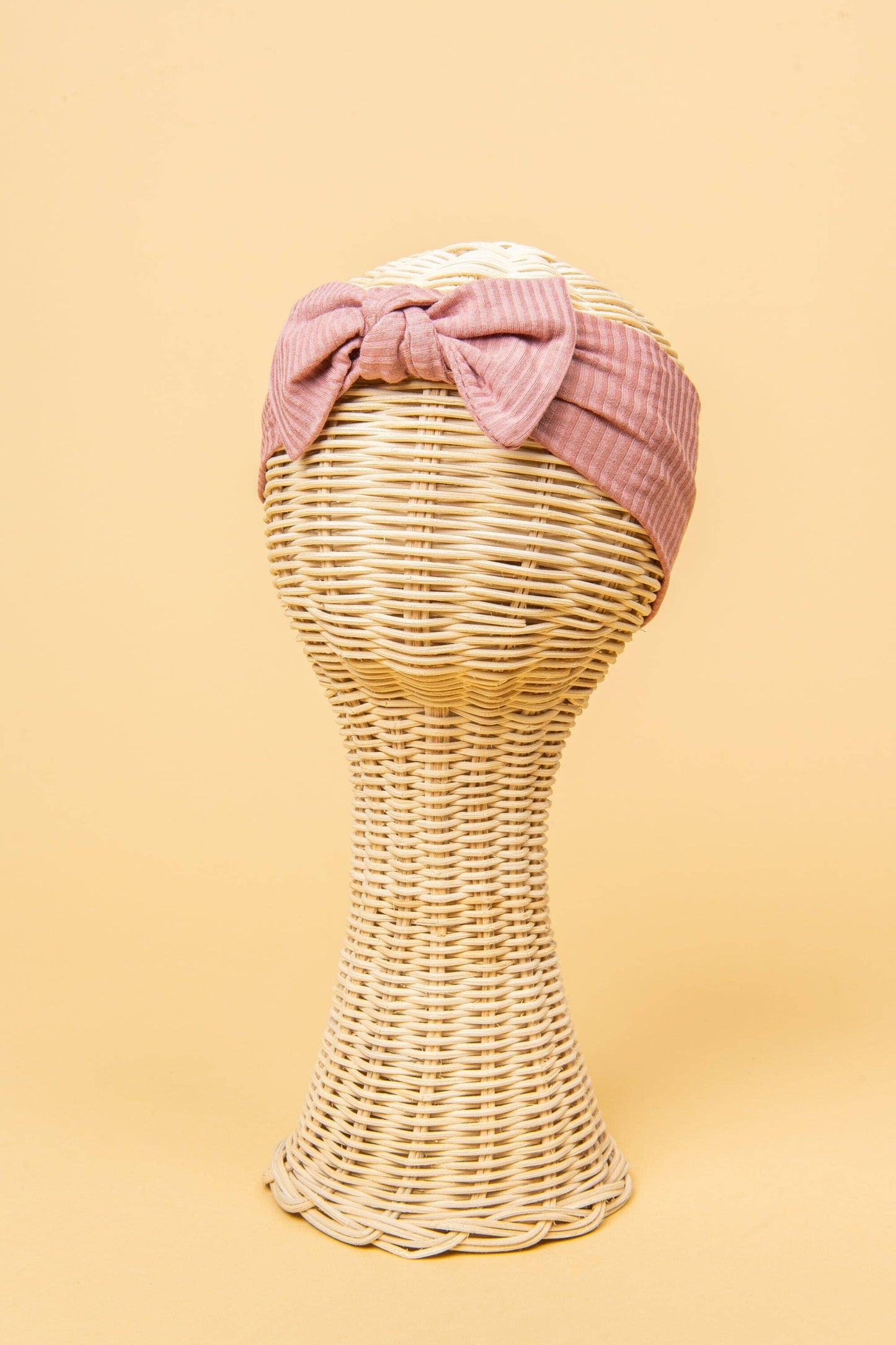 Made from the most luxuriously soft bamboo fabric, in a trendy ribbed texture. The fabric is incredibly soft, and super stretchy. With a removable bow, this also doubles as a plain headband. Perfect for newborns, infants & toddlers.