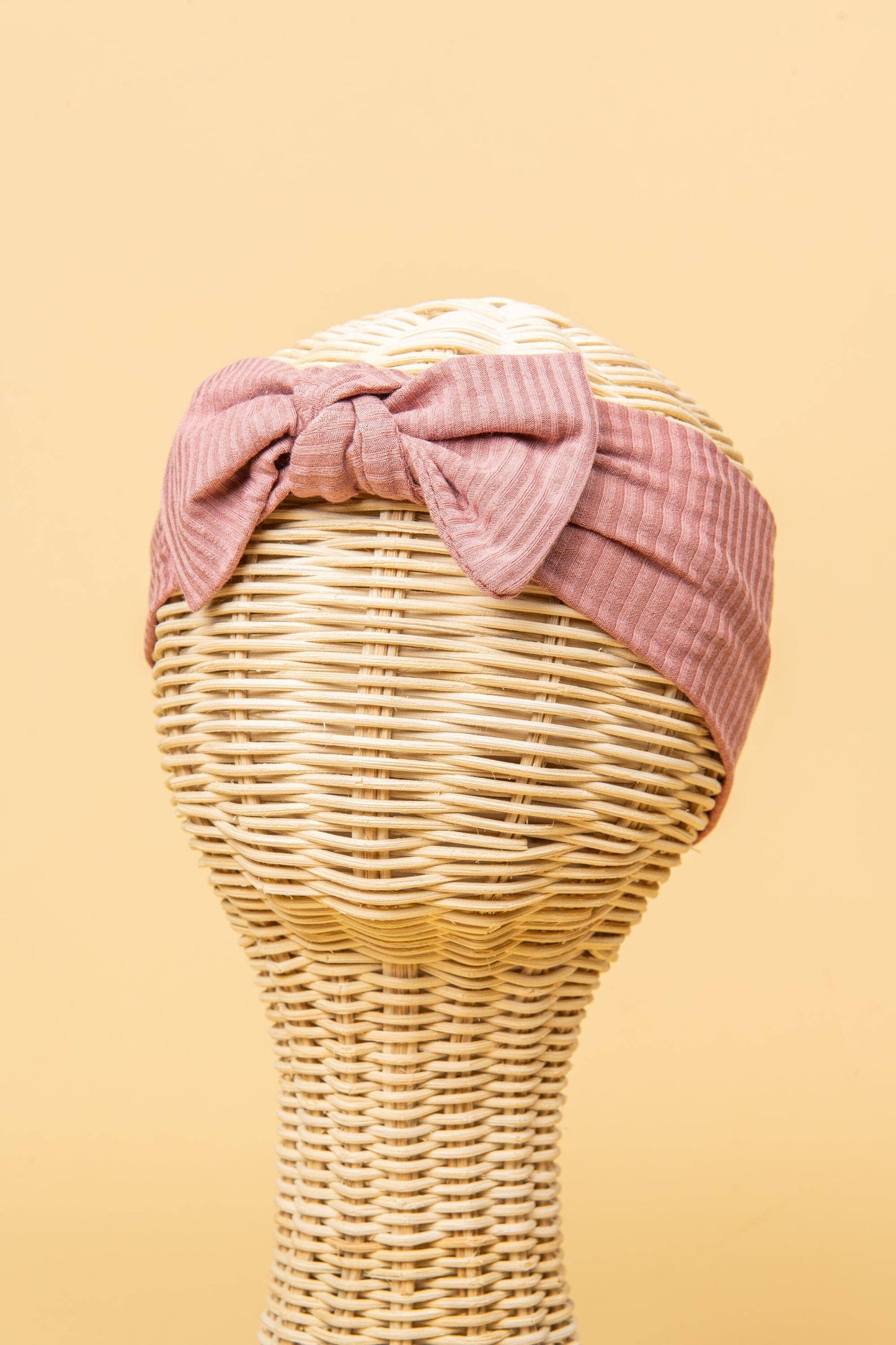 Made from the most luxuriously soft bamboo fabric, in a trendy ribbed texture. The fabric is incredibly soft, and super stretchy. With a removable bow, this also doubles as a plain headband. Perfect for newborns, infants & toddlers.