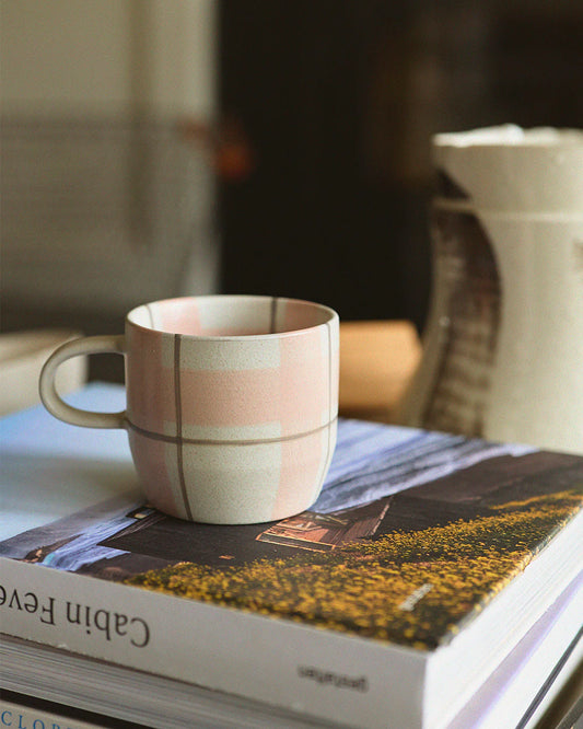 Hand-painted tartan, stripes, and gingham checks both inside and out make these mugs truly charming. We truly think they are the Cat’s Pyjamas. Available in 2 unique designs.&nbsp;

Beautiful designs delicately hand painted inside and out.
350ml Capacity