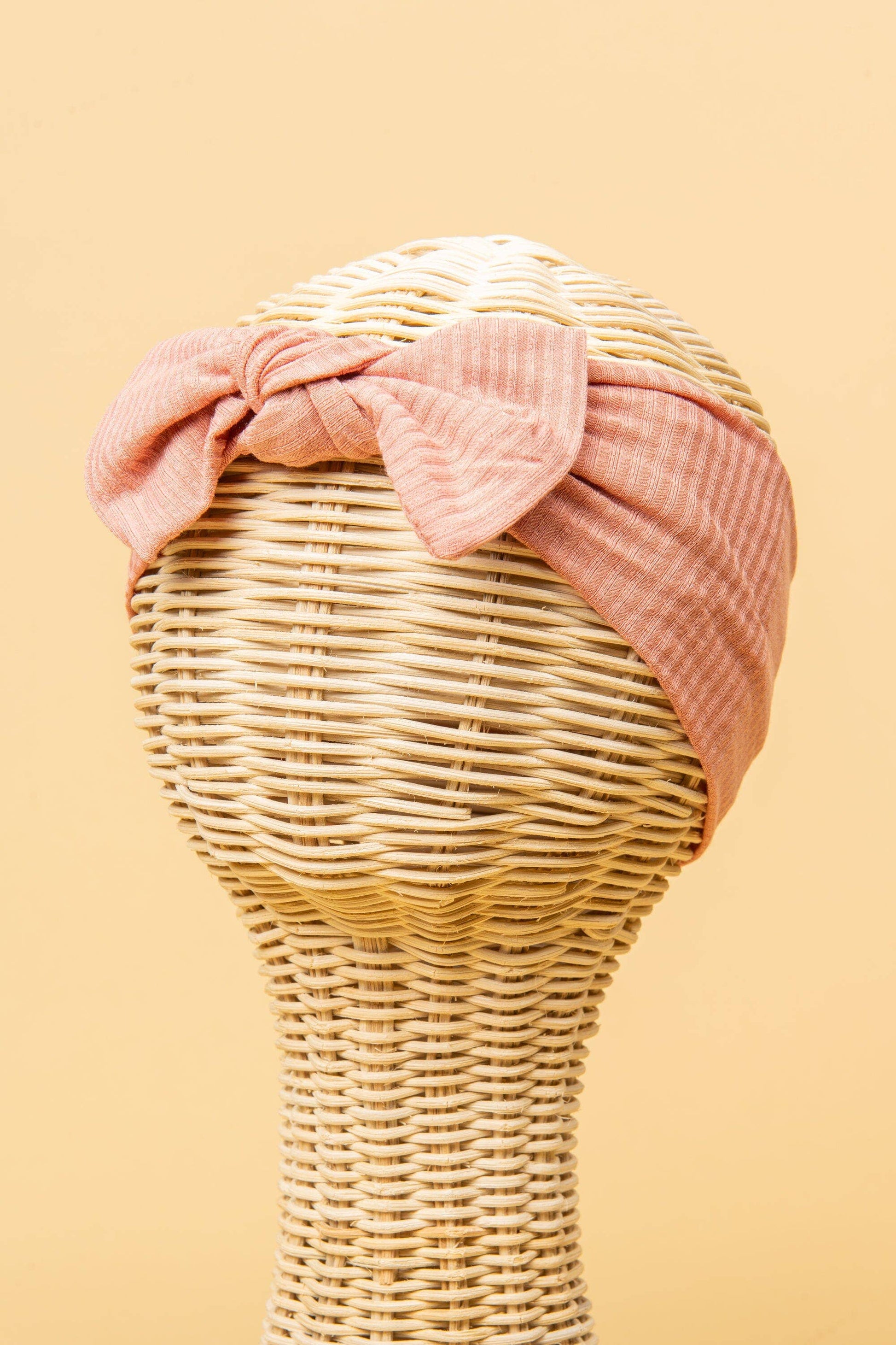 Made from the most luxuriously soft bamboo fabric, in a trendy ribbed texture. The fabric is incredibly soft, and super stretchy. With a removable bow, this also doubles as a plain headband. Perfect for newborns, infants & toddlers.
