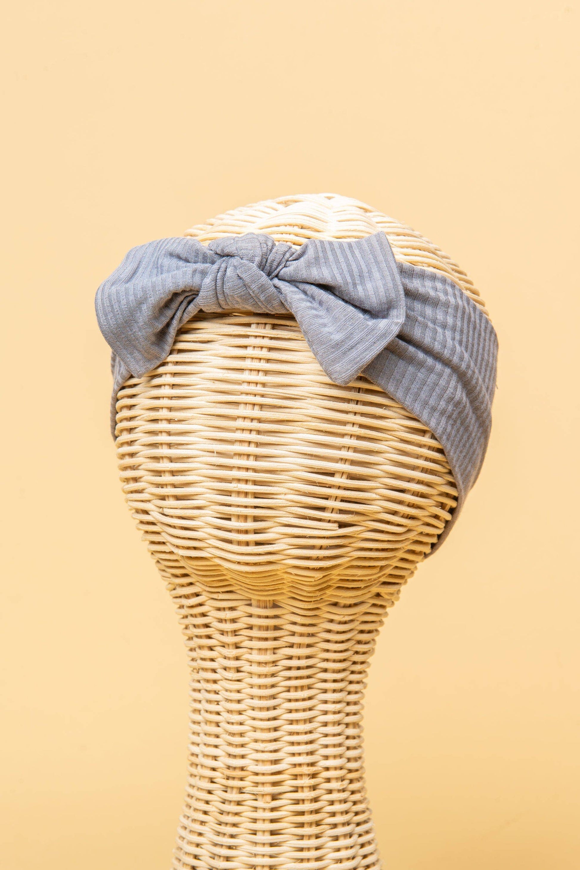 Made from the most luxuriously soft bamboo fabric, in a trendy ribbed texture. The fabric is incredibly soft, and super stretchy. With a removable bow, this also doubles as a plain headband. Perfect for newborns, infants & toddlers.