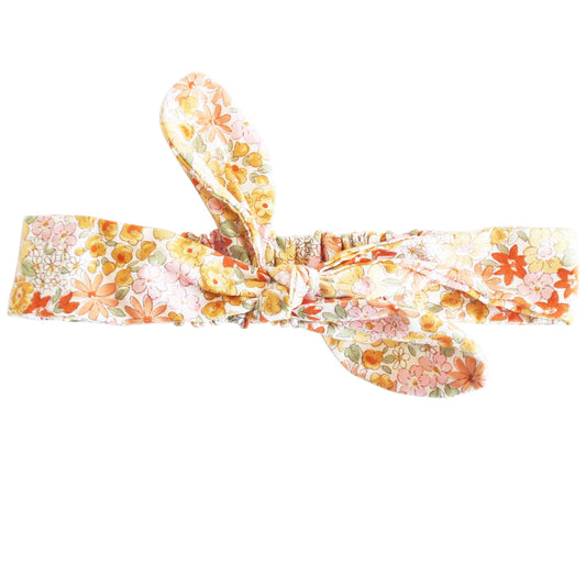 Adjustable head bow band that can be untied and re-tied. It has an encased elastic portion at the back to allow for extra stretch when tied. 