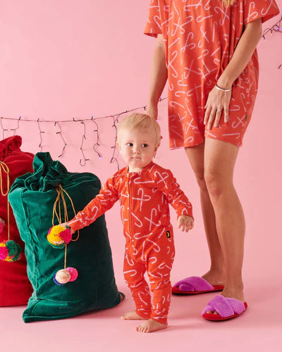 The Candy Cane Red Organic Long Sleeve Zip Romper features a traditional candy cane print on a red base. Our baby rompers are made from the softest organic cotton, free from nasty chemicals, irritants and pollutants. Providing safe and healthy options for both our children and the planet is always a priority. Rest assured we have your best interests at heart.