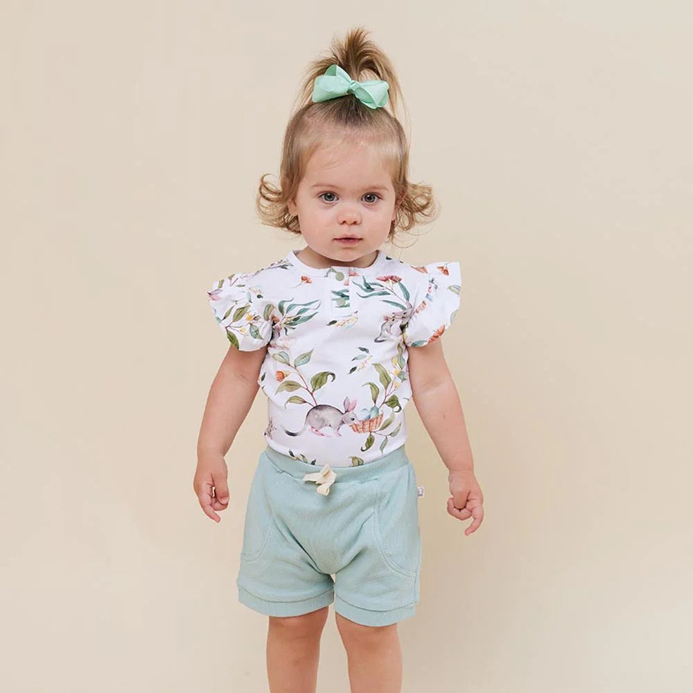 Soft and stretchy, our bodysuits are easy-care and coordinate well with our bloomers, pants and shorts. The bloomers have sweet frills to match the sleeves on this style. Our bodysuits are also really comfortable to sleep in. All Snuggle Hunny clothing is made with GOTS Certified Organic Cotton CU 1182228.  The Bilby print is part of our Easter collection. 