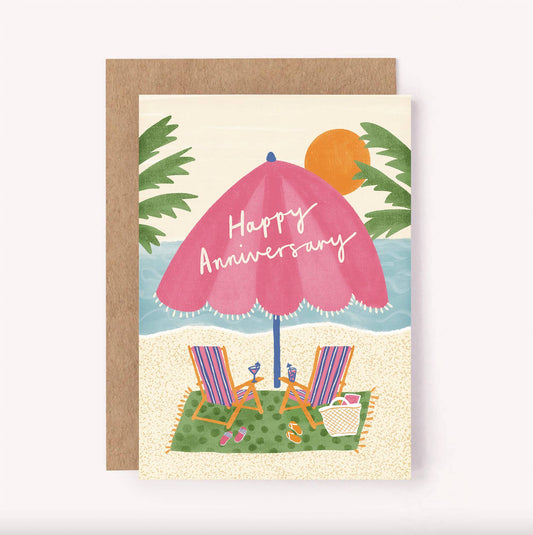 Send sunny anniversary wishes to your significant other or a couple celebrating their anniversary with this colourful illustrated, beach themed greeting card.  Hand-lettered "Happy Anniversary" sits across a pink striped beach umbrella, surrounded by palm trees, as the sun sets on a pair of cute retro striped beach chairs and some cocktails.  Blank inside for a personal message