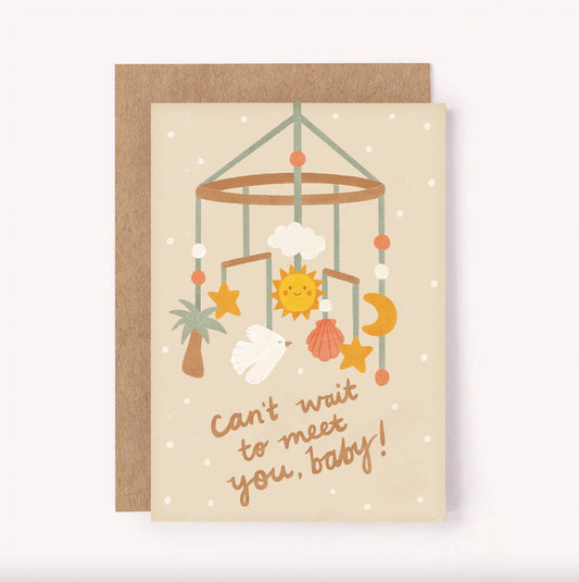 This "Can't wait to meet you, baby" greeting card is perfect for a baby shower or welcoming a new arrival.  Created in a gender neutral colour palette, set on a beige background is a sweet baby hanging mobile with stars, moon, sun, shells, a palm tree and bird above the hand-lettered message.  Blank inside for a personal message - A6 / 105 x 148mm