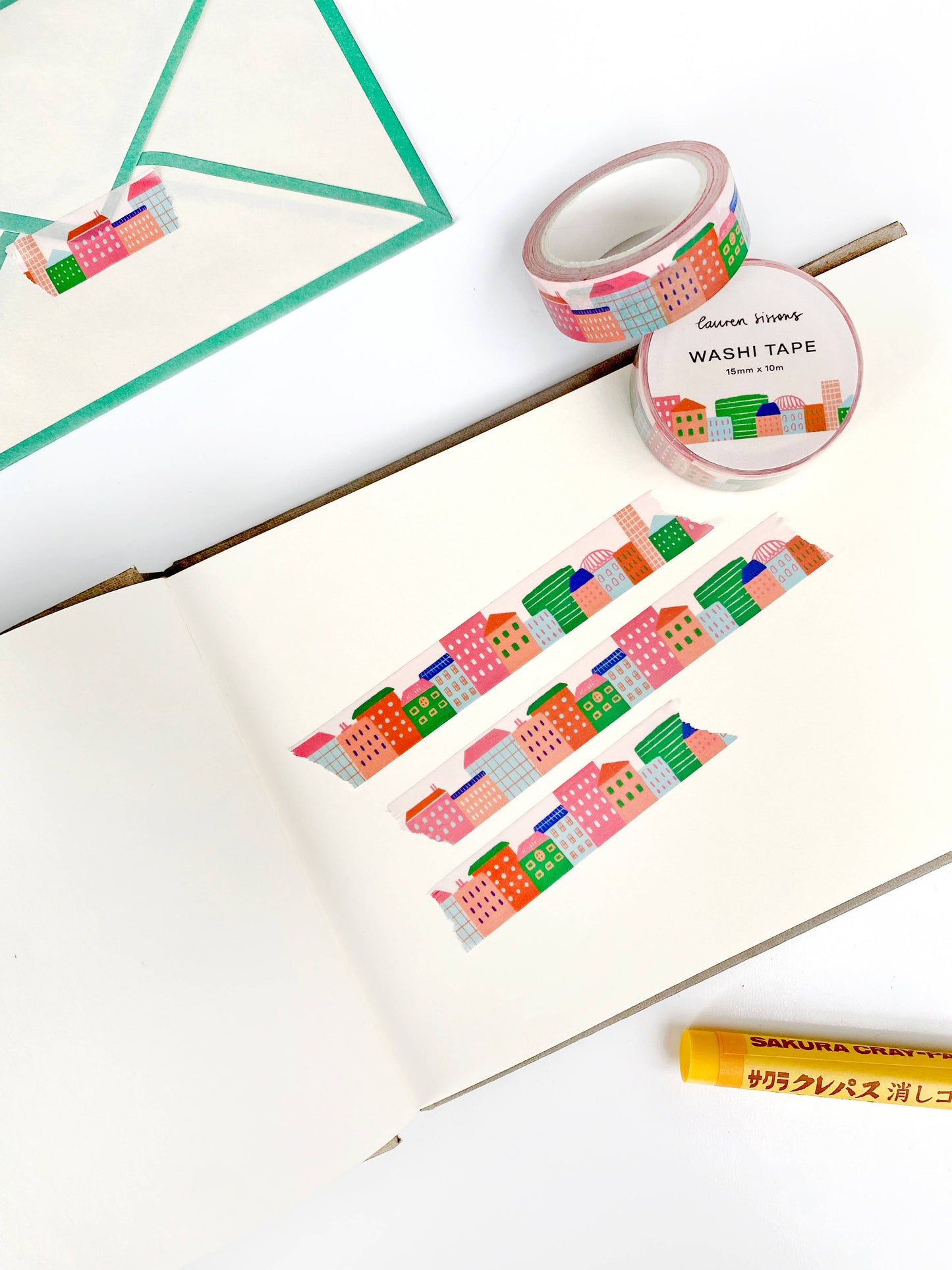 Illustrated city skyline colourful washi tape. Washi is a lightweight decorative tape that removes without reside - making it reusable and ideal for scrapbooking, journalling, stationery, crafts and more.