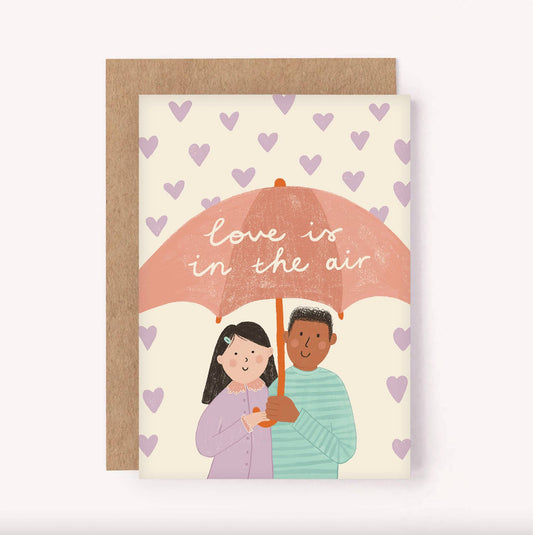 Illustrated "Love is in the Air" greeting card, featuring a cute couple being showered with mini love hearts.

Perfect for a newly engaged couple, saying Happy Anniversary, Valentines Day or simply sending some LOVE.
